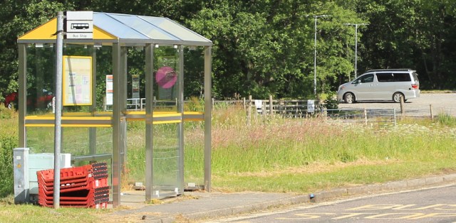 79 bus stop and Beast, in Appin, Ruth hiking the coast of Scotland
