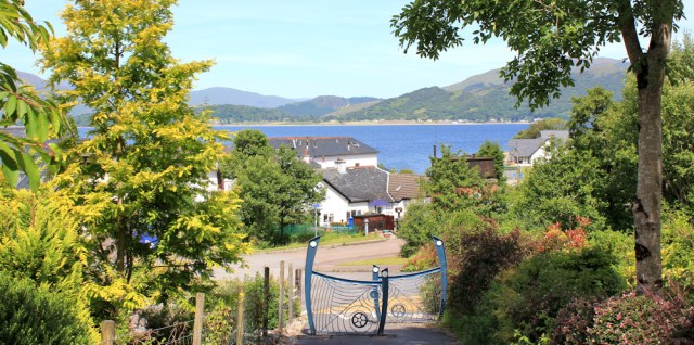 06 back on the A828, Ruth hiking around the Scottish coastline