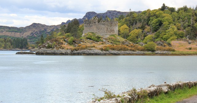 31 castle on the rocks, Ruth walking towards CastleTioram. Doirlinn, Scotland