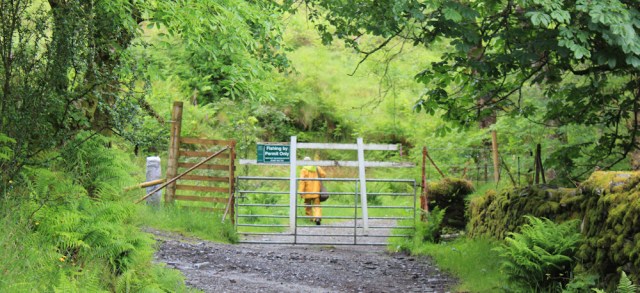12 man with machete, Ruth hiking over the Knoydart Peninsula, Scotland