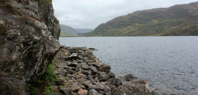 21 rocky path beside water, Ruth hiking the shore of Loch Morar