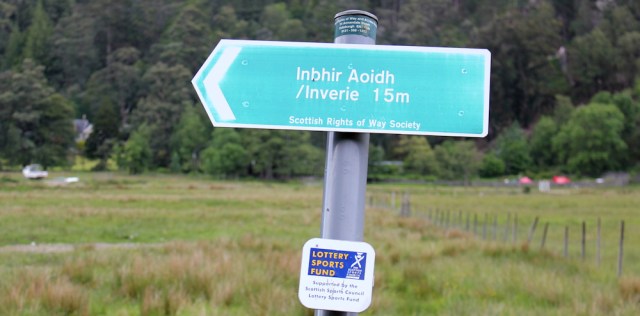 60 signpost to Inverie, Ruth walking round the coast of Scotland