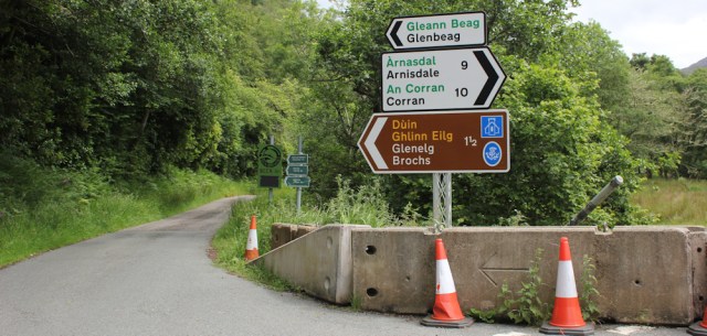 31 signpost at Gleann Beag, Ruth hiking around the Glenelg peninsula