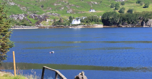 01b North Strome jetty, Ruth walking the shore of Loch Carron