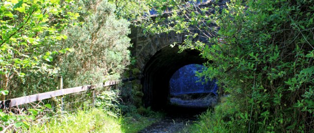 08 under the railway line, Ruth hiking round the coast of Scotland