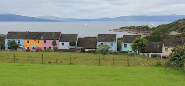 17 Erbusaig and coloured houses, Ruth walking the coast of the Scottish Highlands