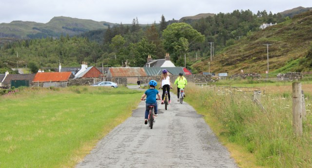 25 children cycling from Duirinish Station, Ruth walking the coast of the Scottish Highlands