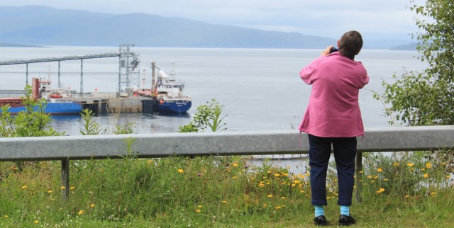 27 woman photographer, Ruth crossing Skye Bridge, coastal walk