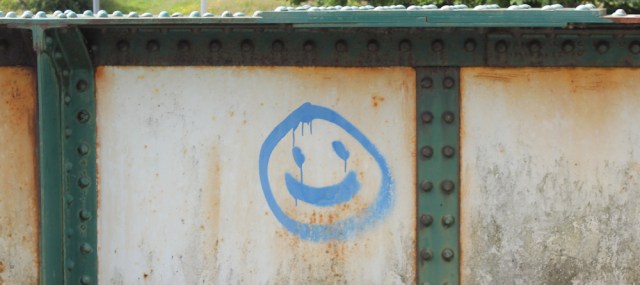 37 smiley face on railway bridge, Plockton, Ruth walking the coast of the Scottish Highlands