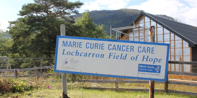 76 Marie Curie field of hope, Ruth walking the shore of Loch Carron