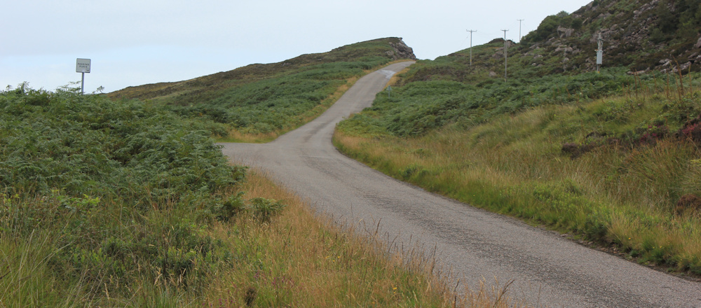 02 steep hill up to Sand, Ruth walking up the coast of Applecross, Scotland