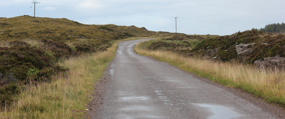 08 wet road, near Sand, Ruth walking up the coast of Applecross, Scotland