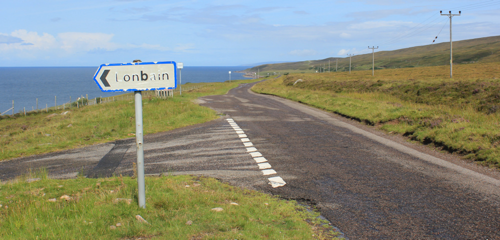 18 Londbain sign, Ruth walking up the coast of Applecross, Scotland