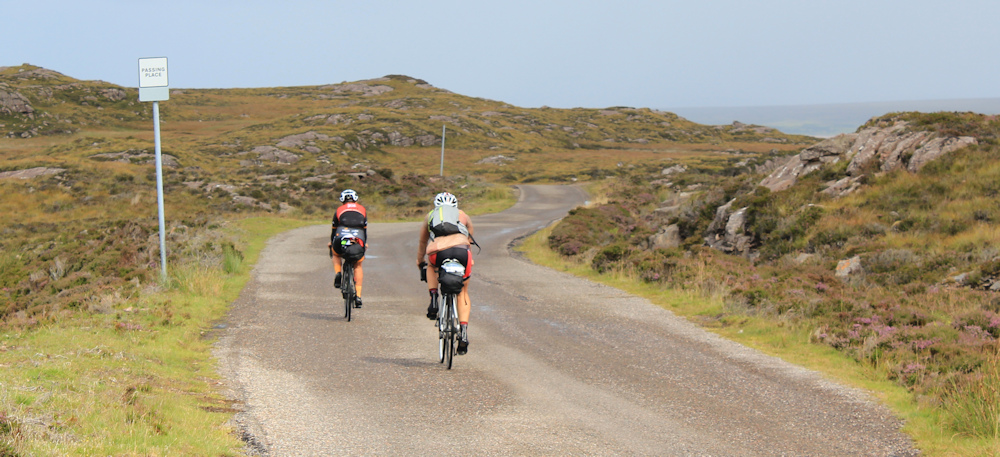13 touring cyclists, Ruth hiking around the north of Applecross, Scotland