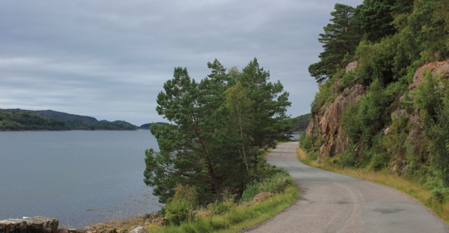 44 winding road with cliffs, Ruth hiking the coast, Wester Ross, Scotland