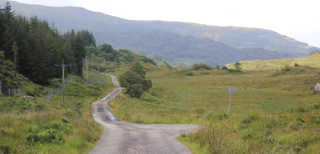 10 winding road along edge of forest, Ruth walking across the Morvern Peninsula, Scotland