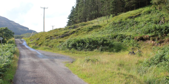 18 Scooty bike waiting in layby, Ruth hiking across the Morvern Peninsula, Scotland