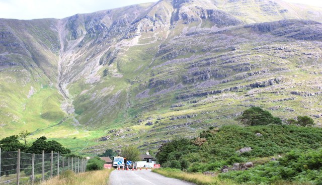 007 road works near Annat, Ruth walking the coast of north-west Scotland